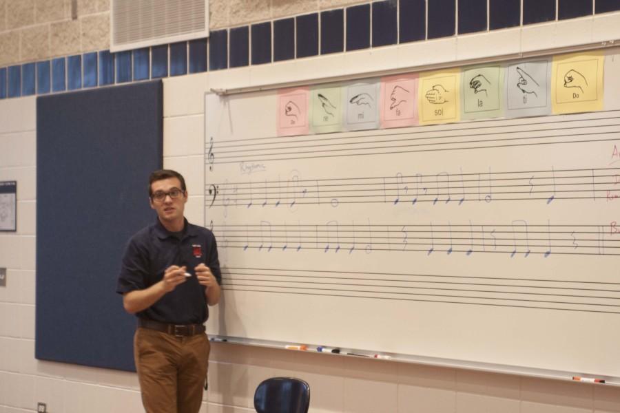 Mr. Giovanatti teaches a choir class. 