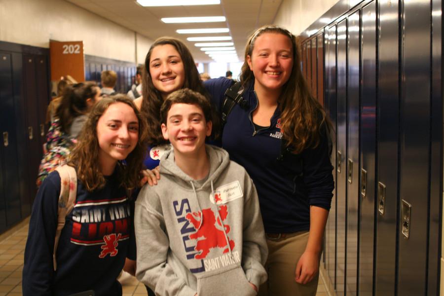 Sophomores Madelyn Olis and Meghan Fleming pose with their shadows, Matthew Olis and Mia Knight.
