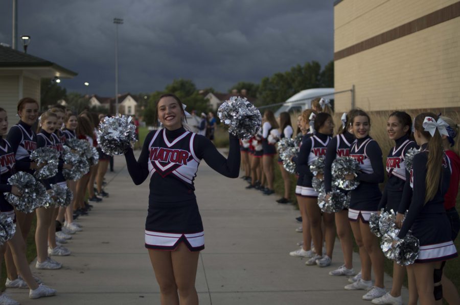 Cheer lines up before a football game.
