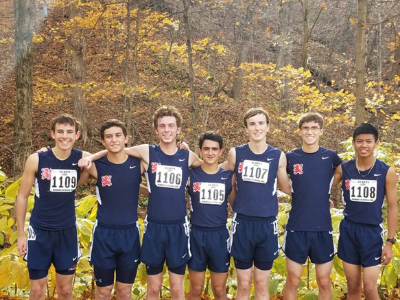 Cross country team poses at State.


