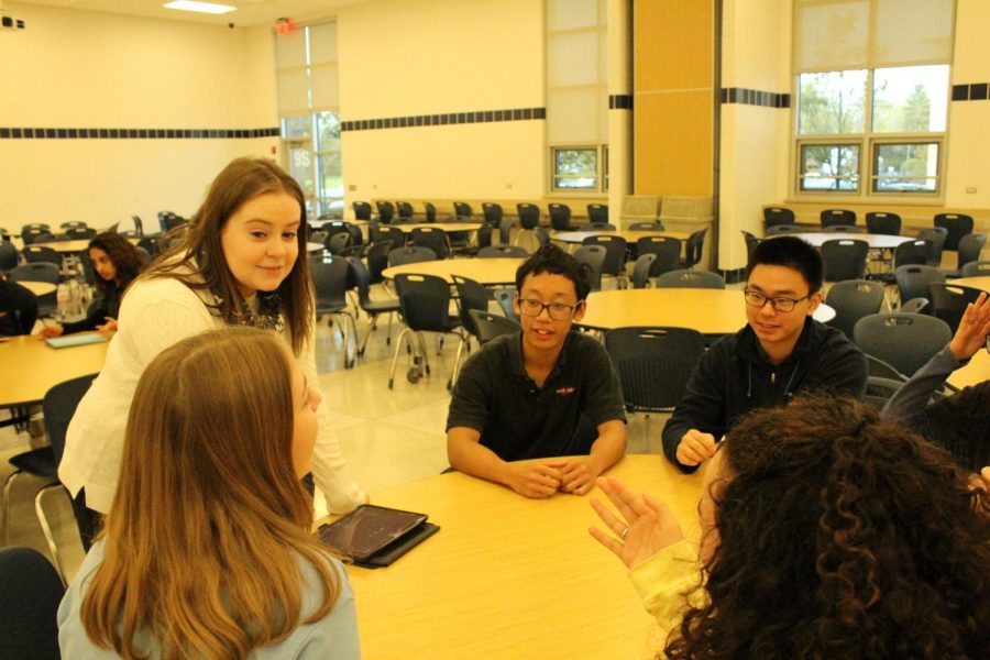 Ms. O’Neill works with members of Speech Club during an activity period.