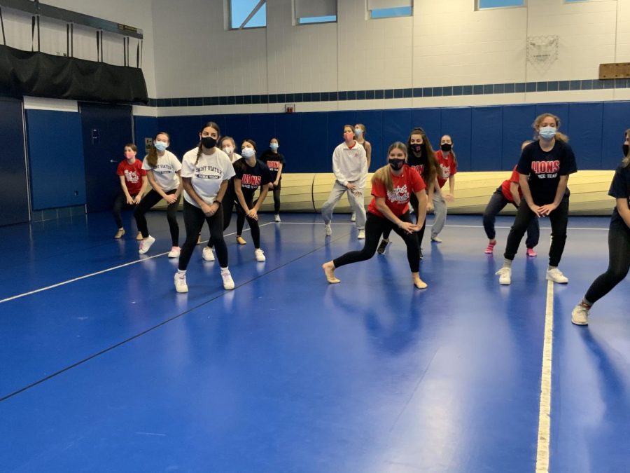 Members of the dance team prepare for the season after clearance from the athletic department. 