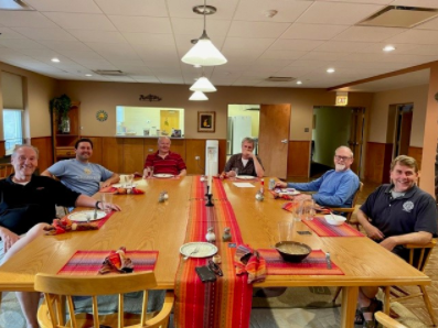 The Viatorian clergy share a meal in their third-floor residence.