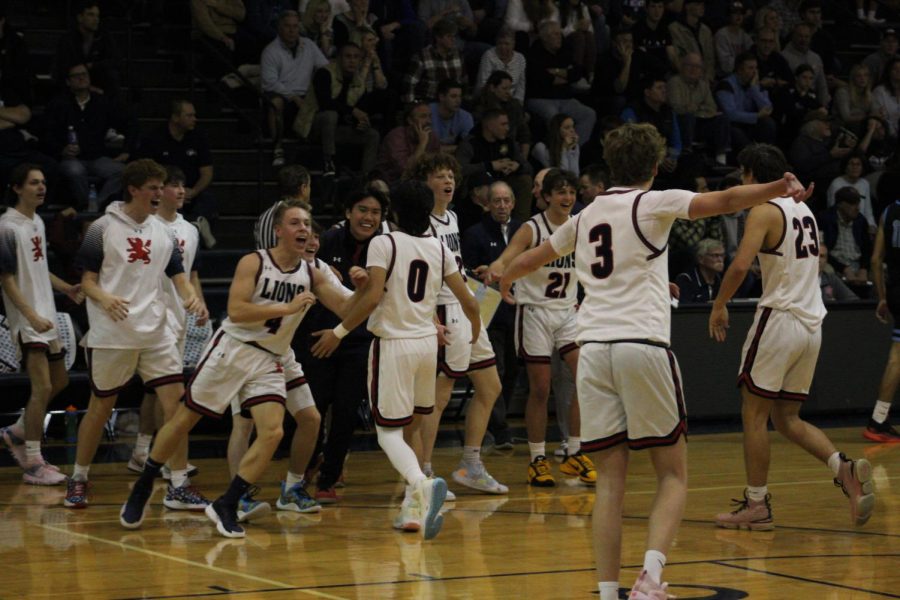 Boys+basketball+team+celebrates+during+a+timeout+against+Prospect.+++++++