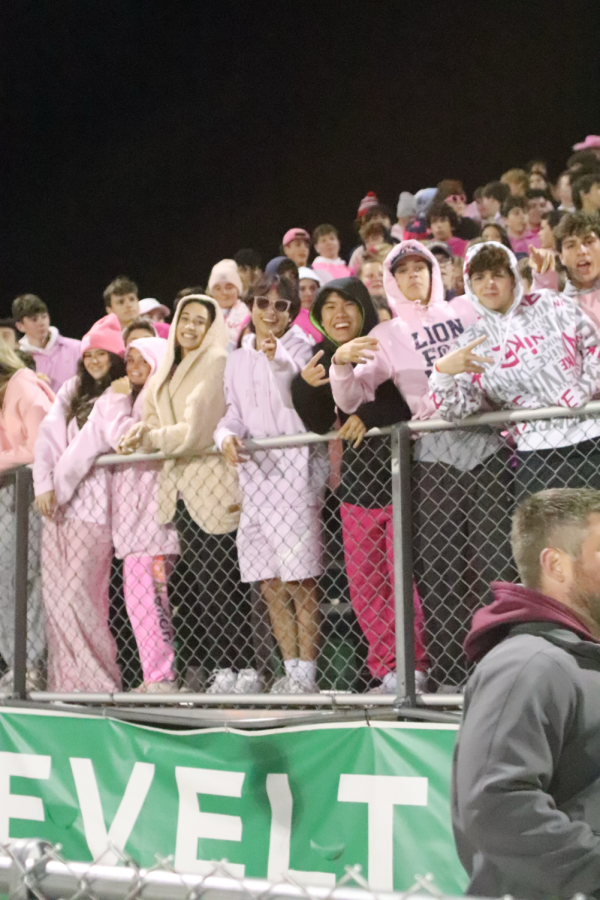Students+at+a+home+football+game+dress+in+the+pink+out+theme.+Opinions+vary+as+to+which+themes+are+socially+appropriate.+++++++++++++++++%0A