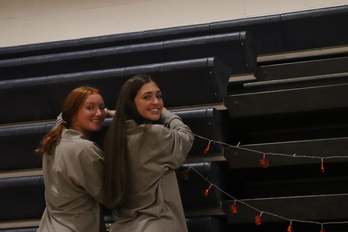 Student council members dedicate time decorating the gym.
