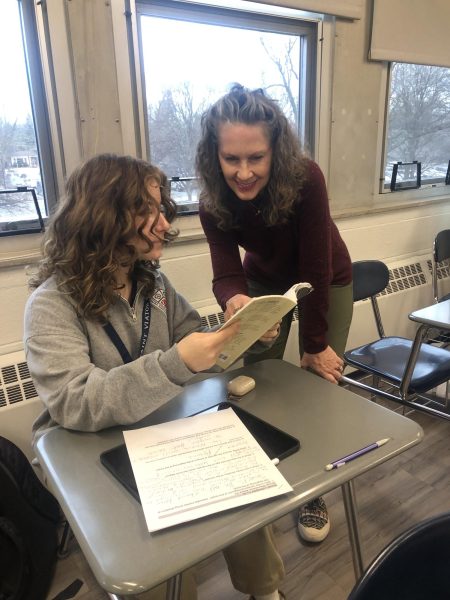 Mrs. Hughes shares a laugh with a student.   