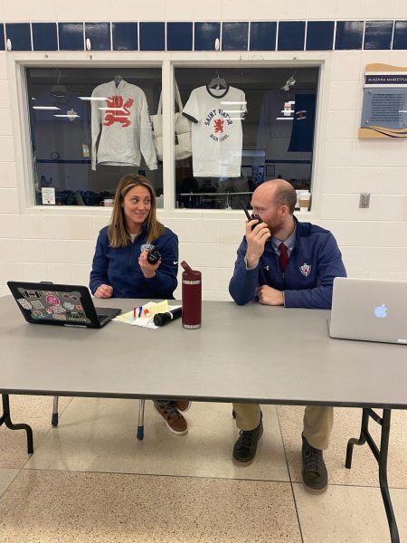 Mrs. McMahon and Mr. Levin pose while supervising lunch. 