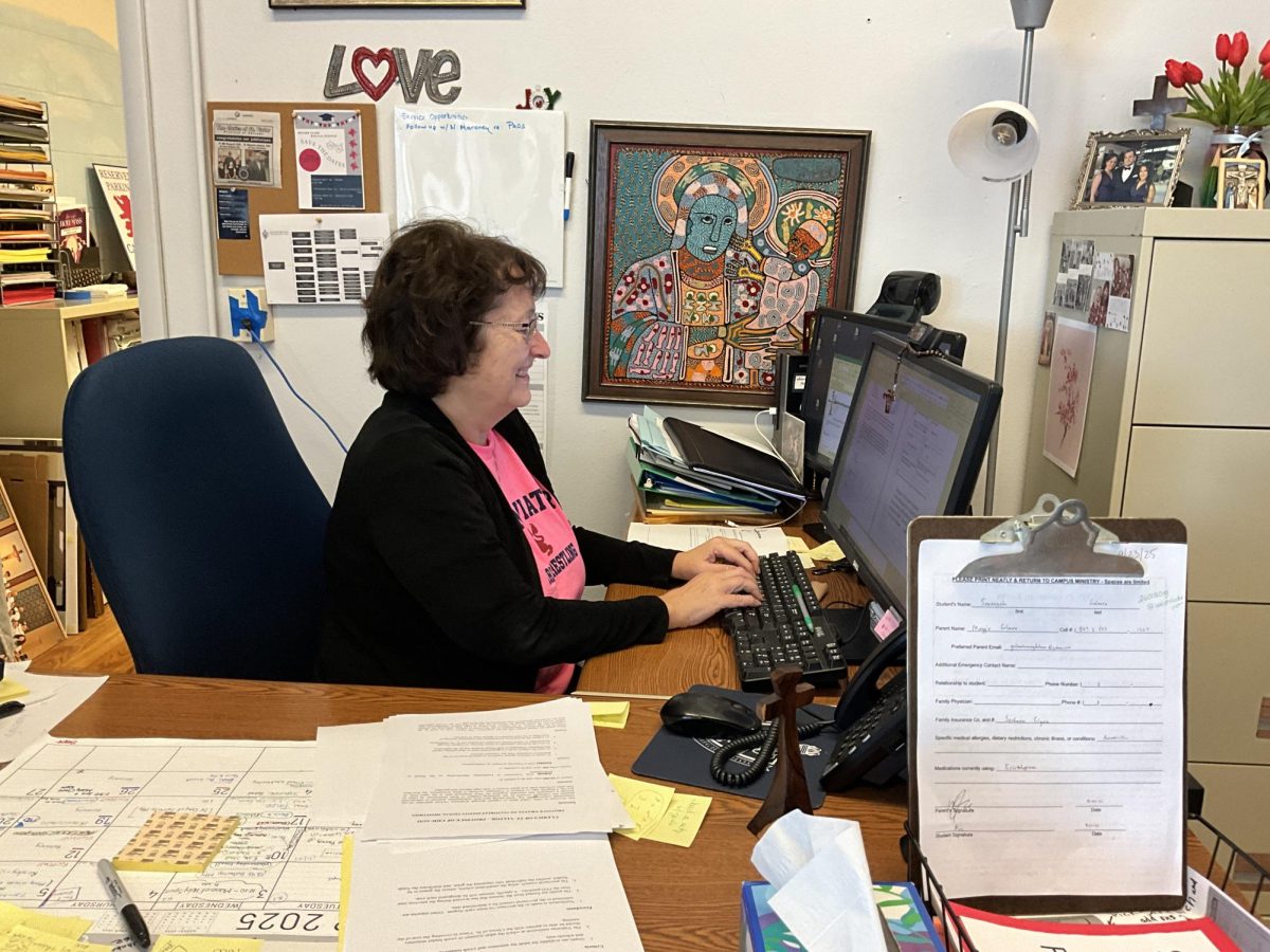 Mrs. Abrahamian works at her new desk.